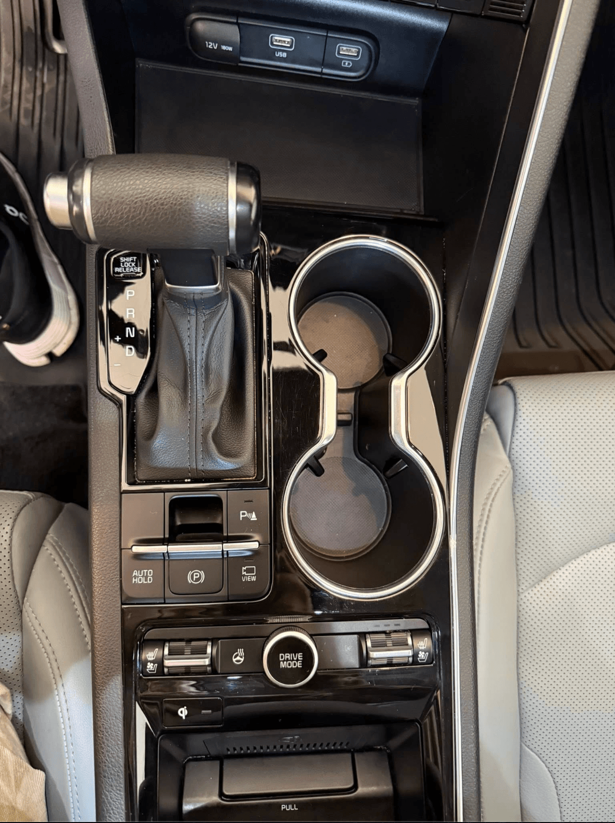 Same center console clean and polished after a mobile interior detail
